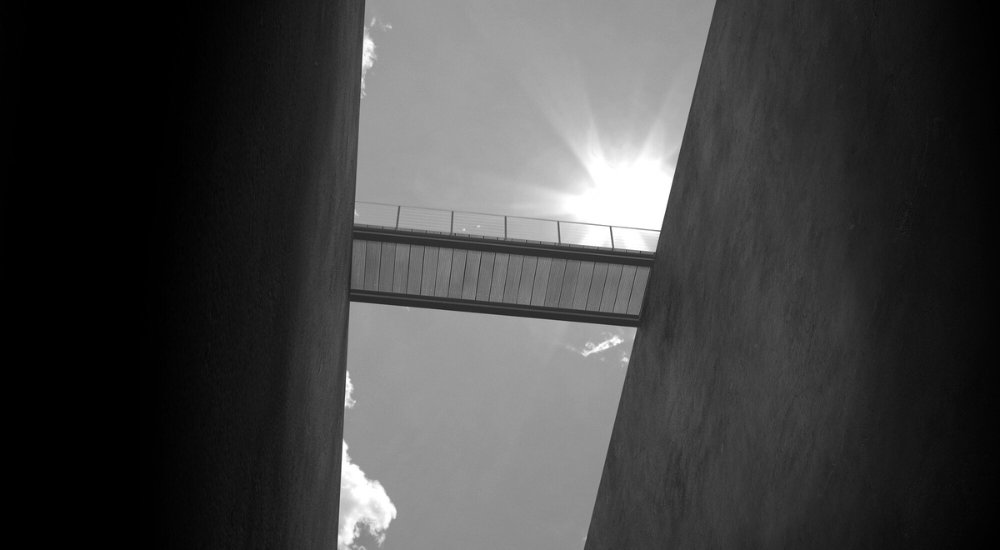 a bridge with the sky in the background